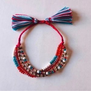 Multi-Strand Beads Adjustable Bracelet With Tassels